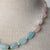 Jennifer’s Aquamarine and Rose Quartz Cross Necklace