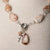 Jennifer’s Flower Agate and Lepidolite Cross Necklace