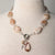 Jennifer’s Flower Agate and Lepidolite Cross Necklace