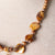 Jennifer’s Golden Pearl Cross Necklace