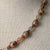 Jennifer’s Leopard Jasper, Rutilated Quartz, and Cubic Zirconia, Copper Cross Necklace