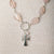 Jennifer’s Rose Quartz, Glass, and Lepidolite Cross Necklace