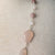 Jennifer’s Rose Quartz, Glass, and Lepidolite Cross Necklace