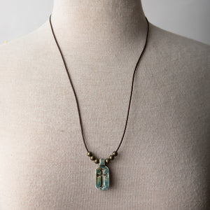 Jennifer’s Unisex Ceramic and Leather Cross Necklace