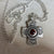 Kathy’s Handcrafted Silver Cross with Red Gemstone